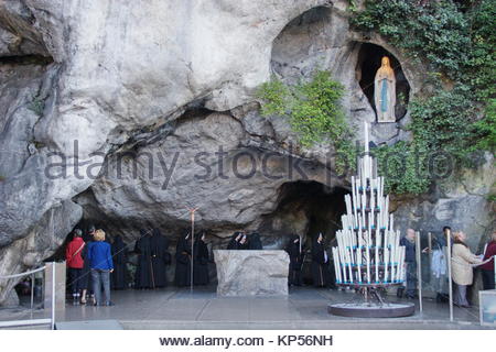 Lourdes, France : Pilgrims visiting the Our Lady of Lourdes statue in ...
