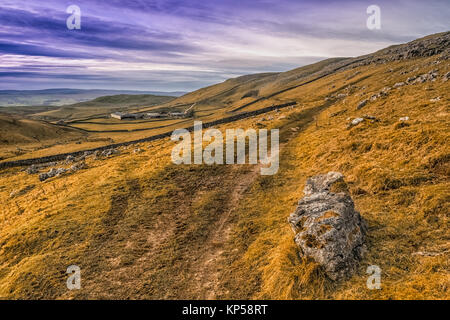 Hill walking above Settle and Malham in the Yorkshire Dales Stock Photo