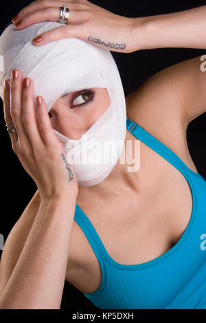 Female Holds Face First Aid Gauze Wrapped Head Injury Pain Stock Photo