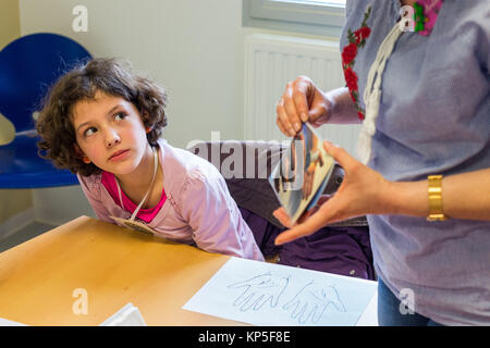 Diabetic children participating in a therapeutic education workshop animated by a nurse. Pediatric department of Angouleme hospital, France. Stock Photo