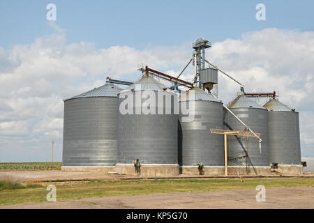 Group of Generic Grain Silos beside a road Stock Photo