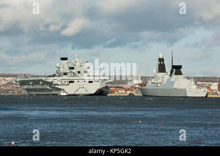 Royal Naval ships alongside in HMNB Portsmouth. Aircraft carrier HMS Queen Elizabeth and Destroyer HMS Diamond seen clearly. Stock Photo