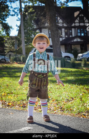 young toddler boy wearing lederhosen a traditional german costume worn during Oktoberfest Stock Photo