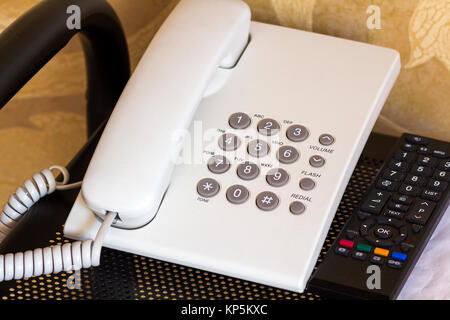 Close up of telephone device at office desk, communication technology concept Stock Photo