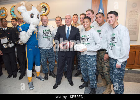 U.S. Vice President Mike Pence (center) poses for a group photo with the U.S. Naval Academy mascot Bill the Goat and students during the U.S. Naval Academy pep rally at the Pentagon December 7, 2017 in Washington, DC.   (photo by Amber I. Smith via Planetpix) Stock Photo