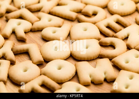 Text Biscuit over the wooden table Stock Photo