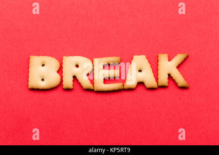 Word break cookie over the red background Stock Photo