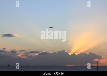 Plane over the sunset - Les Trois Ilets - Martinique FWI Stock Photo