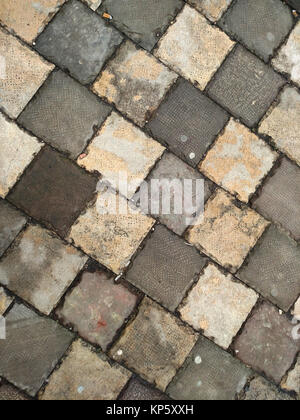Pavement made from old grey concrete tiles Stock Photo