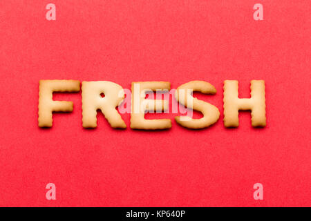 Word fresh cookie over the red background Stock Photo