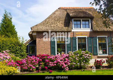 GIETHOORN, NETHERLANDS -typical dutch county side of houses and gardens Stock Photo