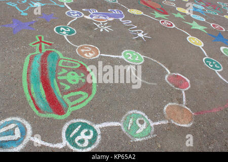 childish drawings as a game on the asphalt Stock Photo