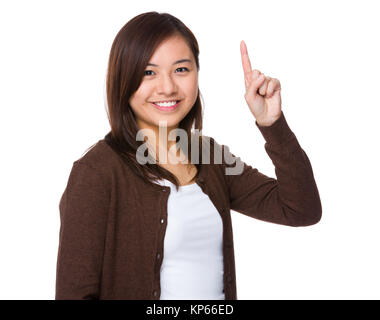 Asian woman with finger showing up Stock Photo