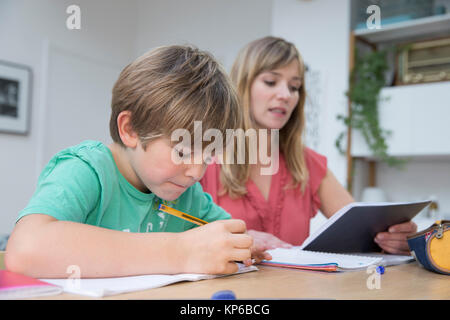 CHILD DOING HOMEWORK Stock Photo