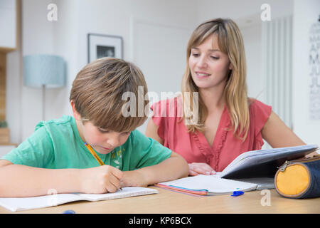 CHILD DOING HOMEWORK Stock Photo