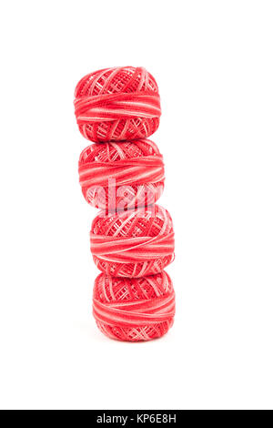 Four red sewing threads on white background Stock Photo