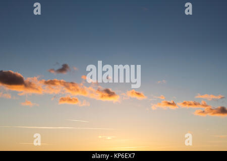 Line of red clouds at sunset. Oxfordshire, UK Stock Photo