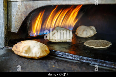 Pita bread in oven Stock Photo - Alamy