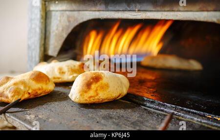 Egypt traditional pita bread in oven conveyor Industry Stock Photo - Alamy