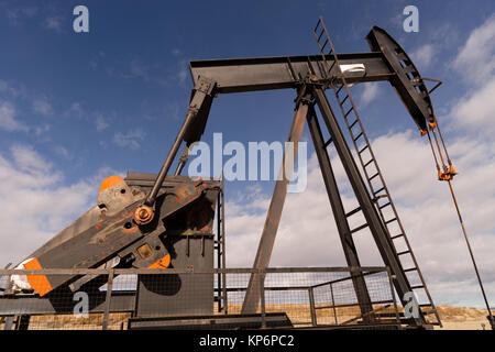 Wyoming Industrial Oil Pump Jack Fracking Crude Extraction Machine Stock Photo