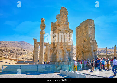 PERSEPOLIS, IRAN - OCTOBER 13, 2017: The numerous tourists next to the All Nations Gate (Xerxes Gate) in Persepolis archaeological site, on October 13 Stock Photo