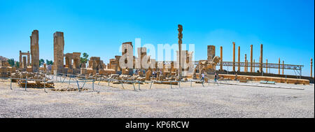 PERSEPOLIS, IRAN - OCTOBER 13, 2017: Panorama Persepolis archaeological complex, the ruins of Hundred Columns Hall are neighboring with slender column Stock Photo