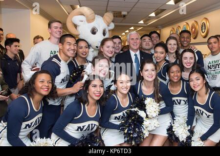 U.S. Vice President Mike Pence (center) poses for a group photo with the U.S. Naval Academy mascot Bill the Goat and the Navy Spirit cheerleaders during the U.S. Naval Academy pep rally at the Pentagon December 7, 2017 in Washington, DC.   (photo by Amber I. Smith via Planetpix) Stock Photo
