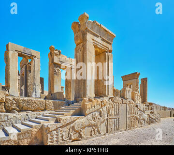 The ancient ruins of Tachara palace in Persepolis archaeological site with preserved reliefs and carved decors, Iran. Stock Photo