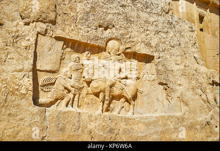 The ancient relief, depicting Triumph of Shapur I in Naqsh-e Rustam Necropolis, Iran. Stock Photo