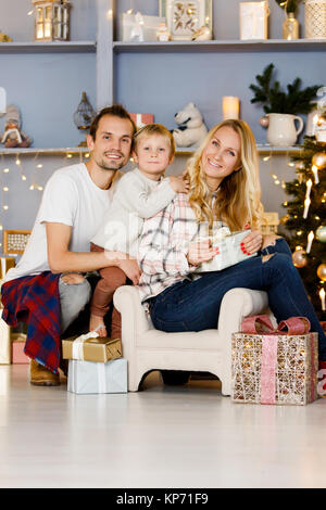 Cheerful family sitting in the living room Stock Photo