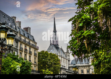 The spire and cathedral of Notre Dame from a nearby square on an early autumn afternoon in Paris France Stock Photo