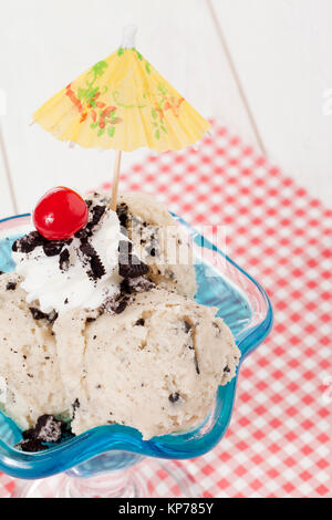 cookies and cream ice cream with cherry and umbrella Stock Photo