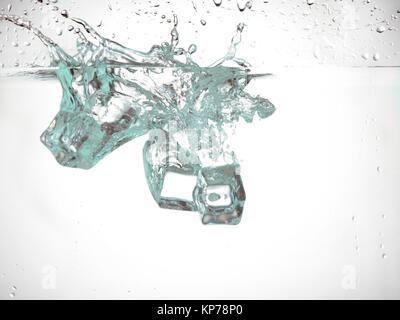 ice cube falling under the water Stock Photo