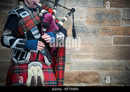 Playing the bagpipes on streets of Edinburgh Stock Photo
