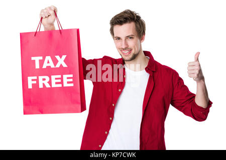 Happy man shopping with his thumbs up and showing tax free Stock Photo