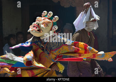 Buddhist lama in the mask White Mahakala performs the Dance Mask at the festival in the monastery. Stock Photo