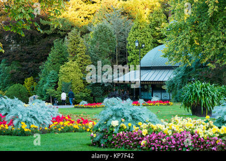 Valley Gardens, Harrogate, Yorkshire, England, UK - beautiful park with cafe, colourful flowers on herbaceous borders & people walking & relaxing. Stock Photo