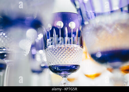 Purple glasses in a row - texture with light behind - for background Stock Photo