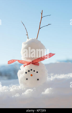 Snowman doing a handstand in the snow Stock Photo