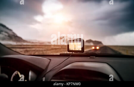 GPS navigator in the car, modern device to find right route, electronic maps all over the world, global positioning system, travel and road trips conc Stock Photo