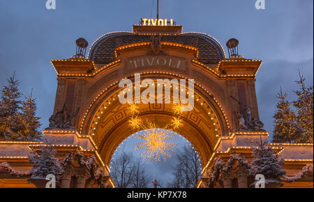 Entrance arch to the Amusment Park Tivoli in Copenhagen, at night against the sky, Copenhagen, Denmark, December 12, 2017 Stock Photo