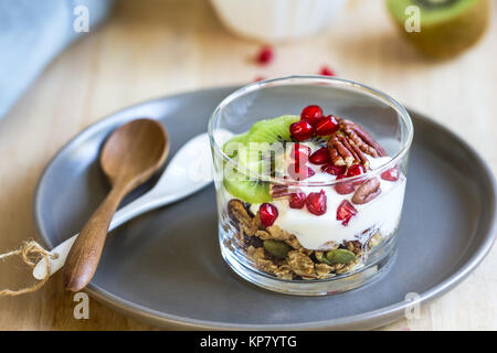Granola with Greek yogurt ,Kiwi and Pomegranate Stock Photo