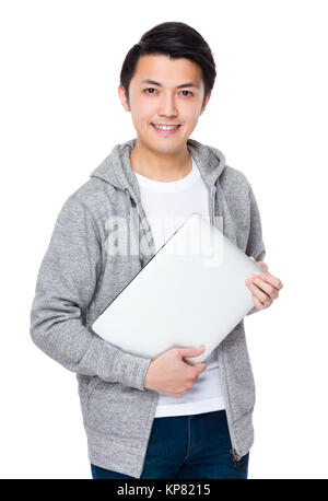 Young man hold with laptop computer Stock Photo