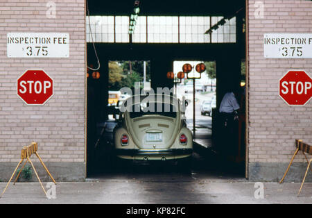 A Volkswagen Bug (beetle) Car Has Just Entered the Safety Lane at an Auto Emission Inspection Station in Downtown Cincinnati, Ohio September 1975 Stock Photo