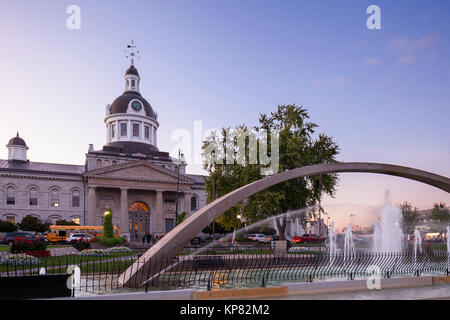 The Confederation Arch Fountain at Confederation Park with Kingston City Hall in the background in downtown Kingston, Ontario, Canada. Stock Photo