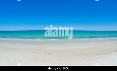 Drone aerial view of wide open white sandy beach, taken at Tennyson, South Australia, pedestal down. Stock Photo