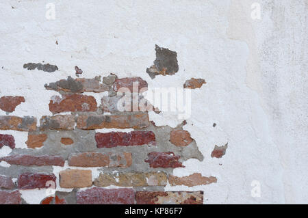 partly plastered brick wall Stock Photo