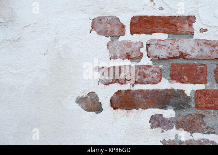 partly plastered brick wall Stock Photo