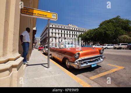 Vintage American car used as taxi in front of the Hotel Parque Central in Center Havana, La Habana, Cuba, West Indies, Central America