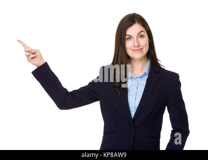 Caucasian businesswoman show with finger point upwards Stock Photo